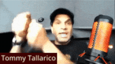 Tommy Tallarico Giving High Five In Front Of Microphone GIF