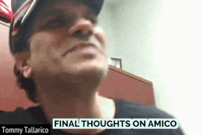 Tommy Tallarico Is Wearing A Black Shirt And A Hat GIF