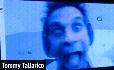 Tommy Tallarico On Screen With Man Sticking Tongue Out GIF