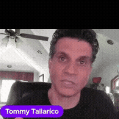Tommy Tallarico Sitting In Chair With Ceiling Fan GIF