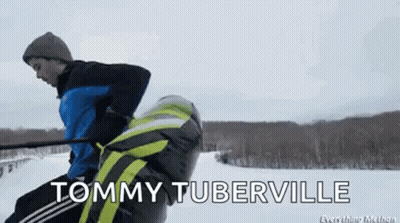 Tommy Tuberville Is Being Pulled By A Person On A Snowmobile GIF