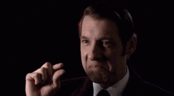 Too Small Man In Formal Black Attire GIF