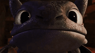 Toothless From How To Train Your Dragon Is Looking At The Camera With A Big Smile On His Face . GIF