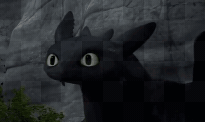Toothless From How To Train Your Dragon Is Looking At The Camera With His Eyes Glowing . GIF