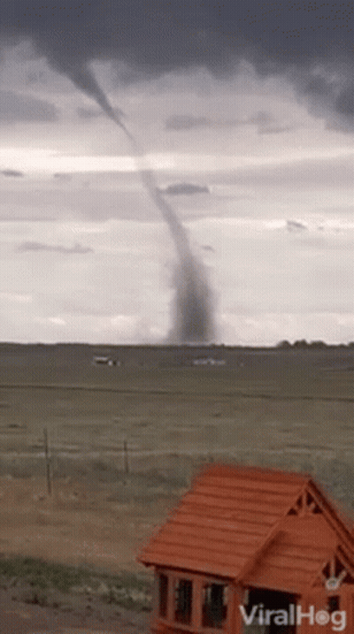 Tornado Moving Through Field With House GIF