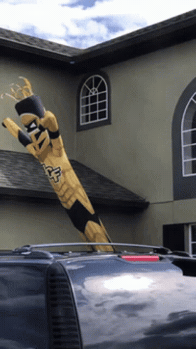 Totem Pole Saying Fox Blowing In Wind GIF