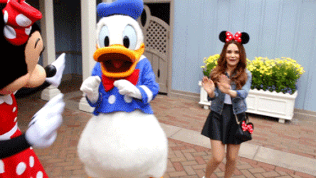 Tourist Happily Dancing With Donald Duck In Disneyland GIF