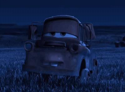 Tow Truck From Cars Sitting In Grass At Night GIF