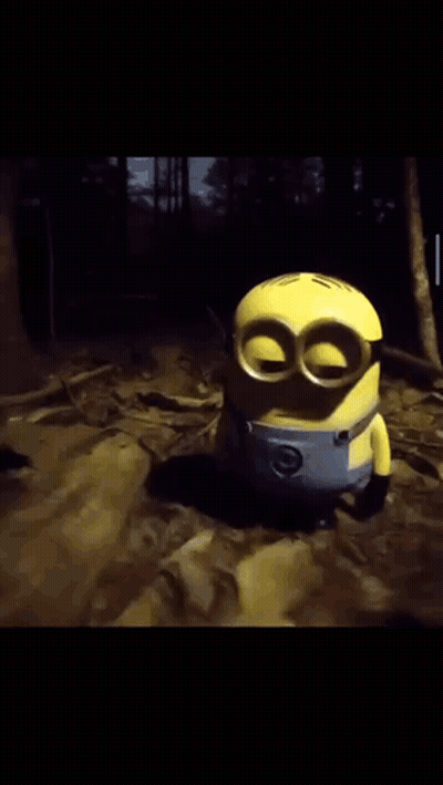 Toy Minion Holding Two Red Balls GIF