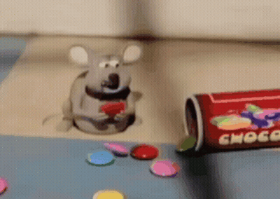 Toy Mouse Sitting In Hole Next To Can Of Choco GIF