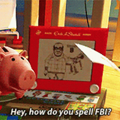 Toy Piggy Bank Next To Etch A Sketch Toy GIF