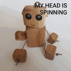Toy Robot Wood Head Spinning GIF