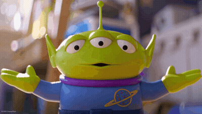 Toy Story Alien With Purple Shirt And Arms Outstretched GIF