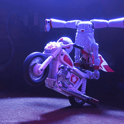 Toy Story Character Doing Trick On Toy Bike GIF