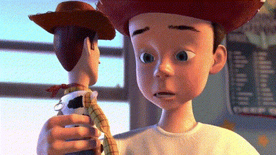 Toy Story Character Holding Woody Doll GIF