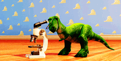 Toy Story Rex Looking On A Microscope GIF