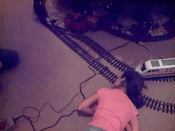 Toy Train Crash Bumped On Girl's Face GIF