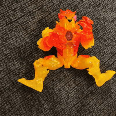 Toy With Orange And Yellow Arms And Legs On Couch GIF