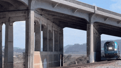Train Going Down Tracks With Smoke GIF
