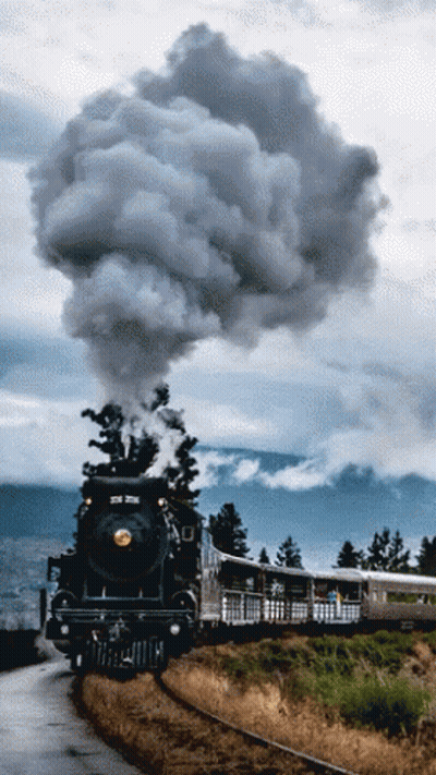 Train Going Down Tracks With Smoke GIF