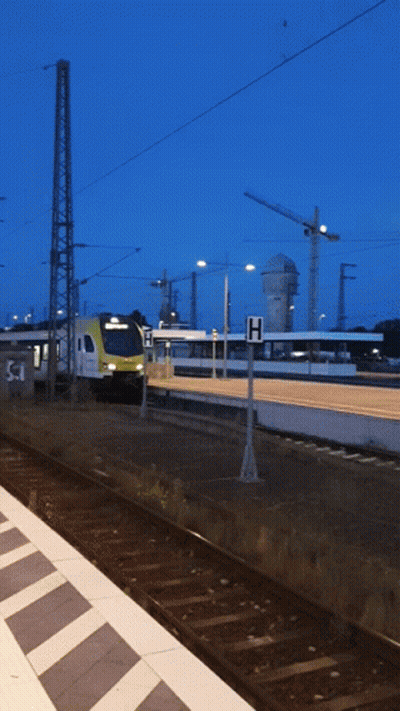 Train Pulling Into Station With H Sign GIF