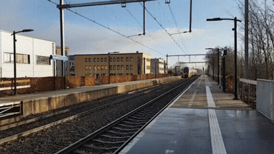 Train Track With Building And CC Sign GIF
