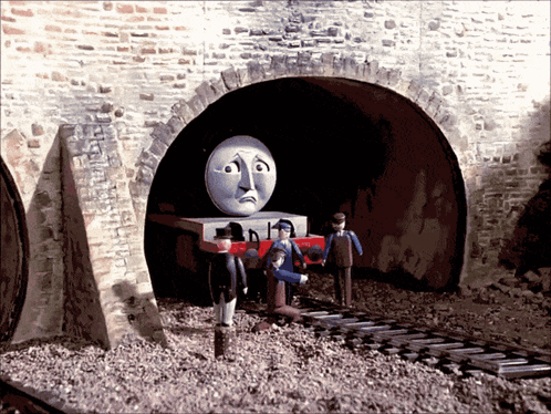 Train With Sad Face Coming Out Of Tunnel GIF