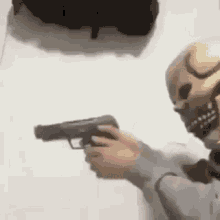 Trained Mask Guy Firing A Gun GIF