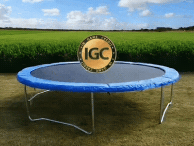 Trampoline With Blue Cover And Gold IGC Logo GIF
