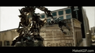 Transformer Standing By City Building GIF