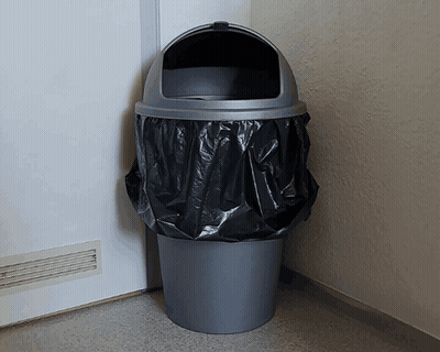 Trash Cans Sitting In Rain On Side Of Road GIF