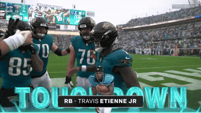 Travis Etienne Jr. Holding Football GIF