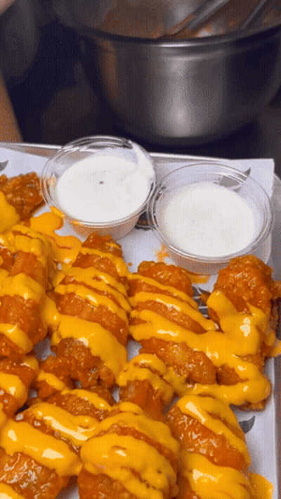 Tray Of Chicken Wings With Cheese And Ranch GIF