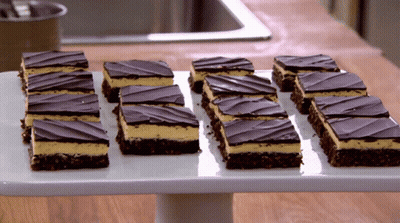 Tray Of Chocolate And Peanut Butter Slices GIF