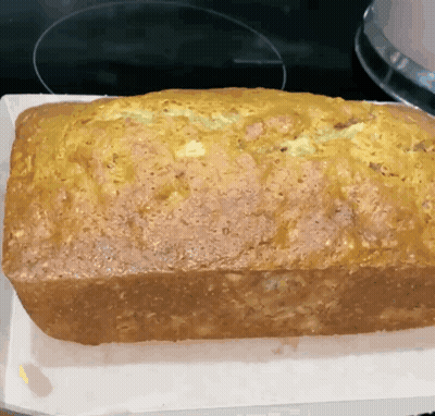 Tray Of Food In Oven With Number 52 GIF
