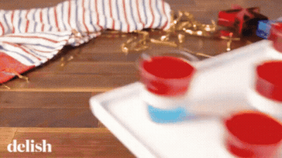 Tray Of Red White And Blue Shot Glasses GIF