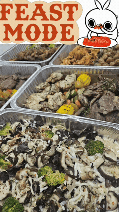Trays Of Food With A Sign That Says Feast Mode On Top GIF