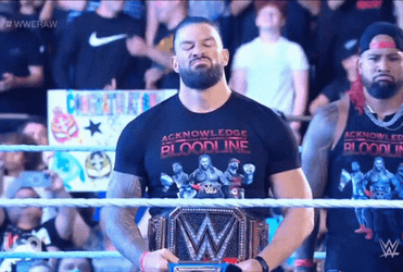 Tribal Chief Roman Holding And Looking His Belt GIF
