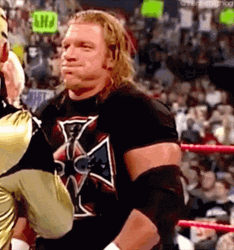 Triple H Controlling Laughter In Mockery GIF