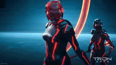 Tron Ares Poster With Two Women In Futuristic Costumes GIF