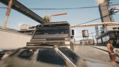 Truck Driving Down Street With Car Behind GIF