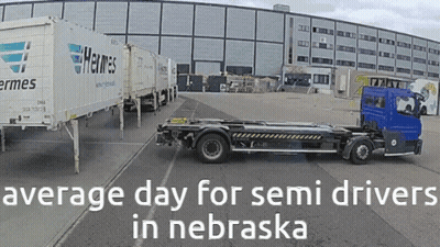 Truck Parked In Front Of Building Saying Average Day For Semi Drivers In Nebraska GIF