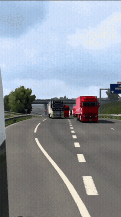 Trucks Driving Down Highway With La Riviera Sign GIF