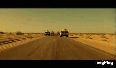 Trucks Driving On Desert Road GIF