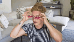 Try To Put On Fake Pink Long Eyelashes GIF