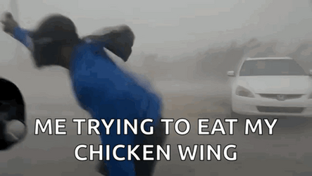 Trying To Eat Chicken Wing Hurricane Meme GIF