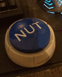 Trying To Press The Nut Button Toy GIF