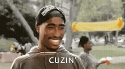 Tupac Shakur Smiling With Hat And Hoodie GIF