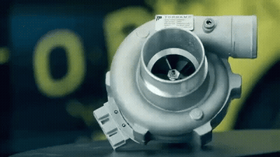 Turbocharger In Front Of Yellow Torgame Sign GIF