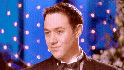 Tuxedo Man On Blue Background With Lights GIF